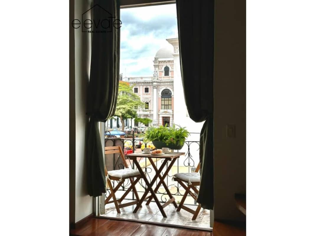 Classic colonial apartment balcony overlooking Casco Antiguo streets and architecture