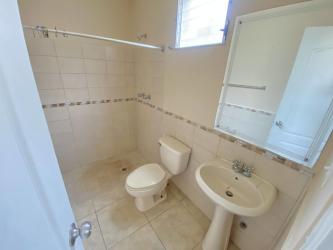 Kitchen with tile floor, large window and ample storage in house Brisas del Golf Arraiján