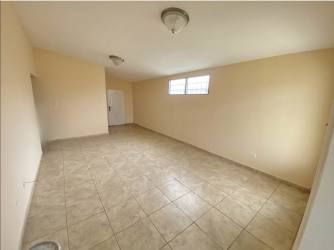 Patio and fenced grassy backyard in family home at Brisas del Golf Arraiján
