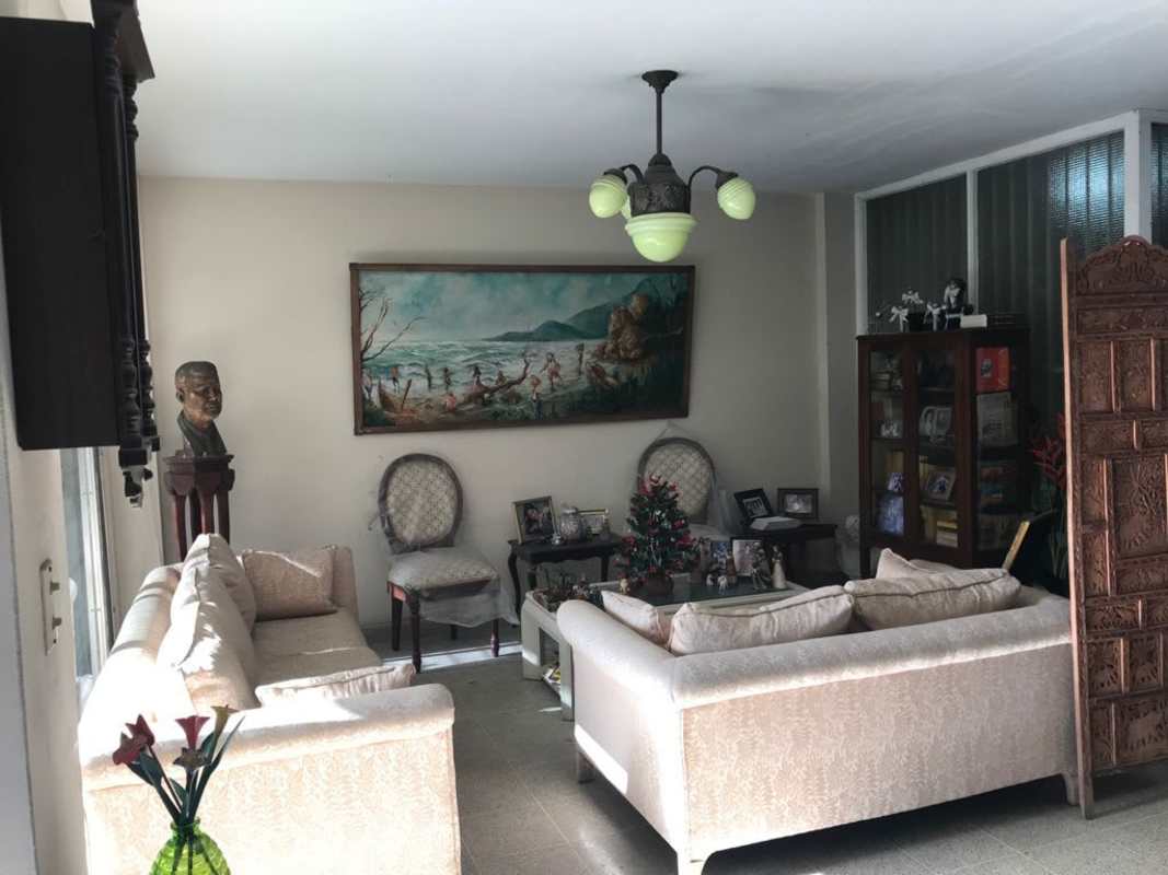 Traditional living room with beige sofas, art, and coffee table in PH Imperial El Cangrejo Panama City