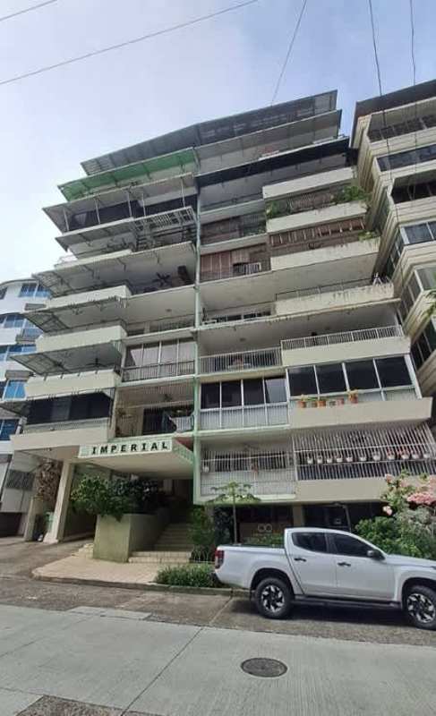 Large dining area with chandelier, curtains and stained glass window in PH Imperial Panama City