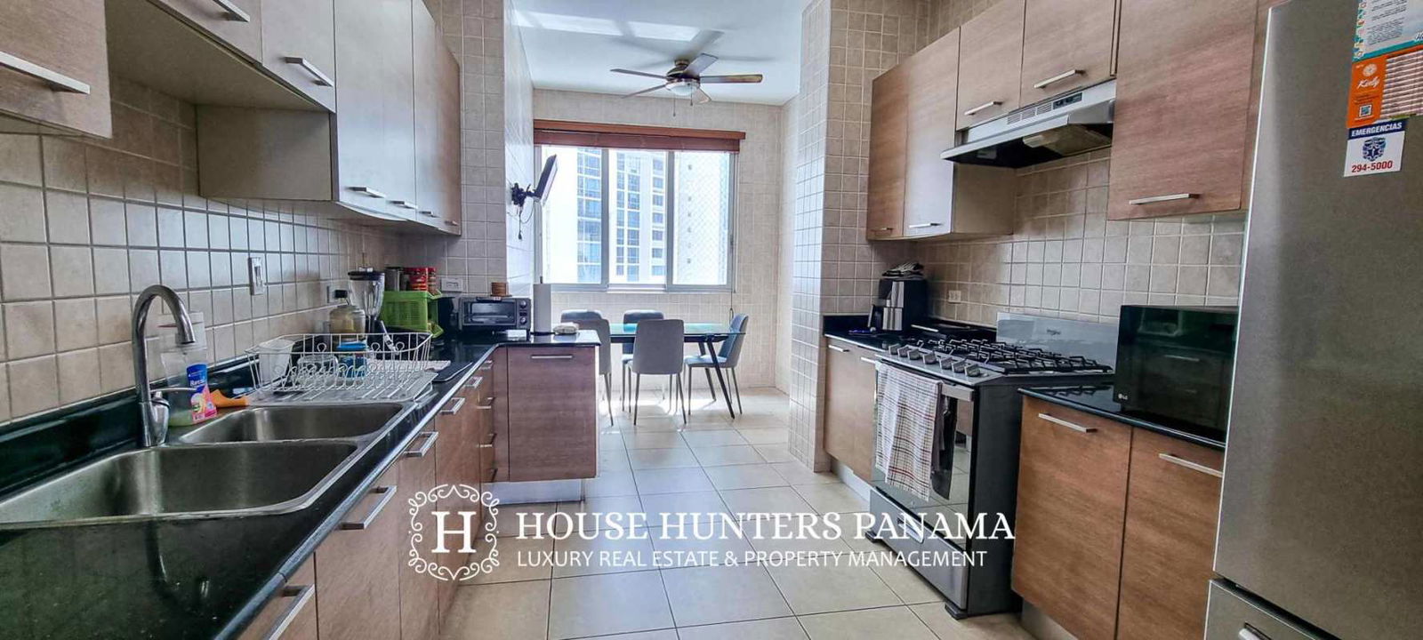 Secondary bedroom with large window and city skyline views in Punta Pacifica Panama