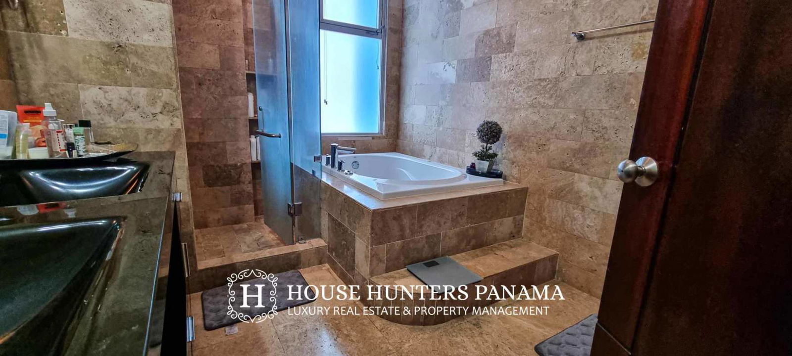 Dining area adjacent to large windows with Panama City view in PH Pacific Village