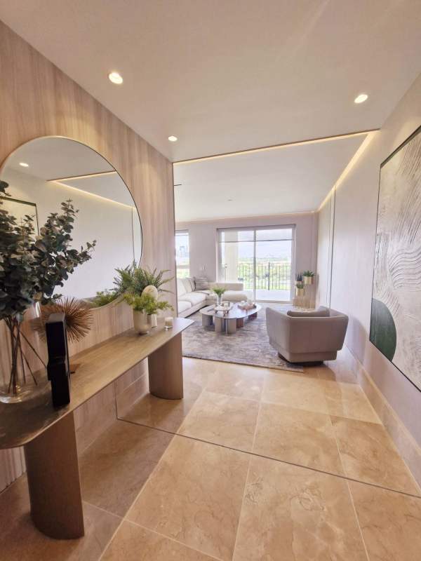 Elegant living dining area with balcony overlooking golf course in duplex penthouse Santa María Panama