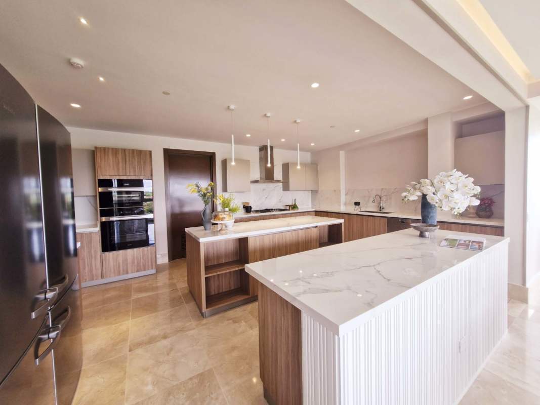 Luxury kitchen with marble countertops, double island and built-in appliances penthouse The Reserve Panama