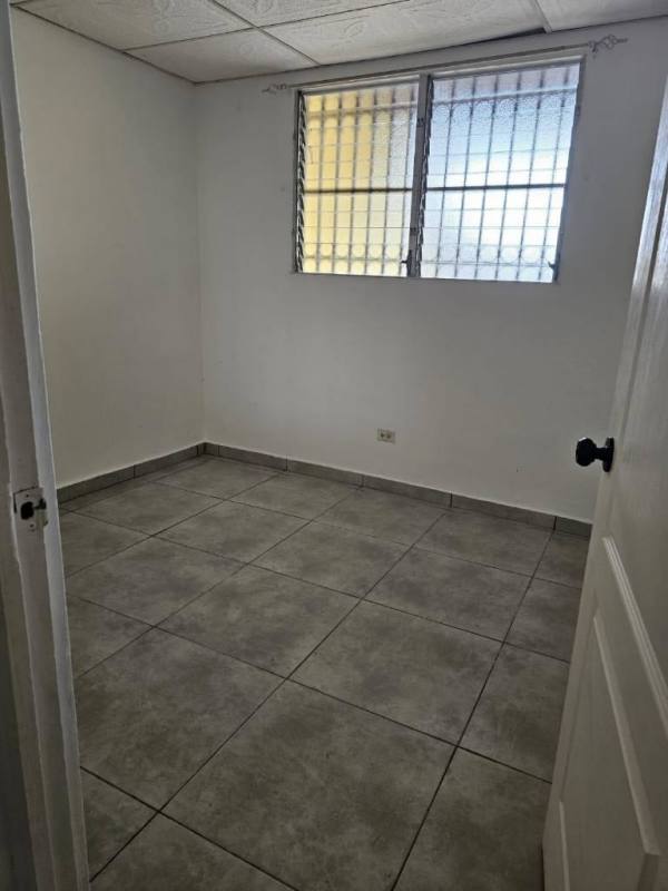 Bedroom with window security bars and tiled floor affordable house San Antonio Camino Real Panama