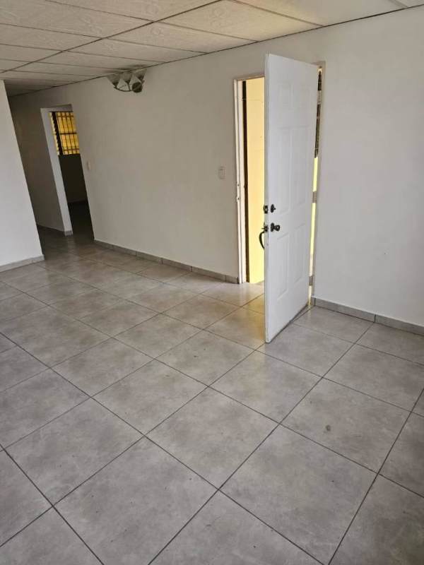 Simple tiled kitchen with metal door window bars affordable home Camino Real San Antonio Panama