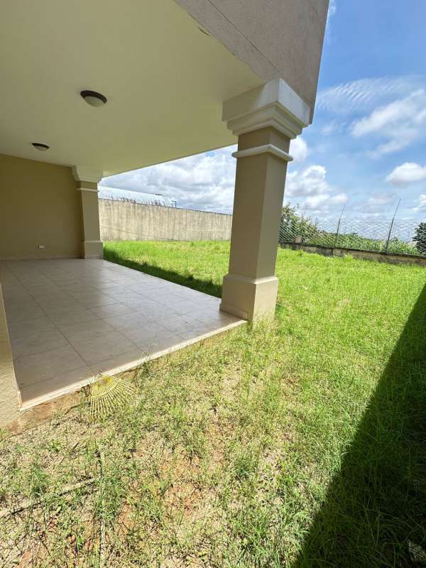 Community pool and playground surrounded by tropical gardens in Brisas del Golf Villa Alta Panama