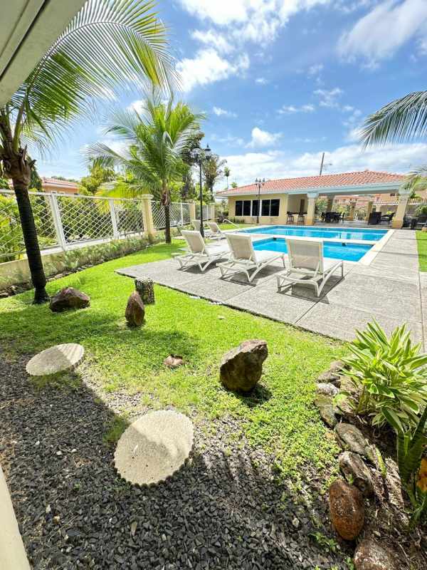 Children playground with green lawn in gated community Villa Alta Brisas del Golf Panama