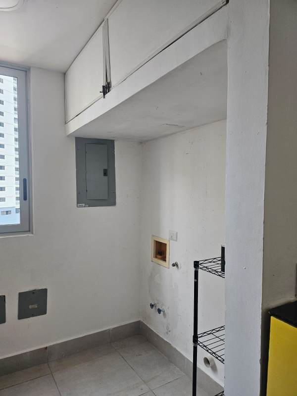 Apartment laundry area with storage and hookups PH Park City Obarrio Panama