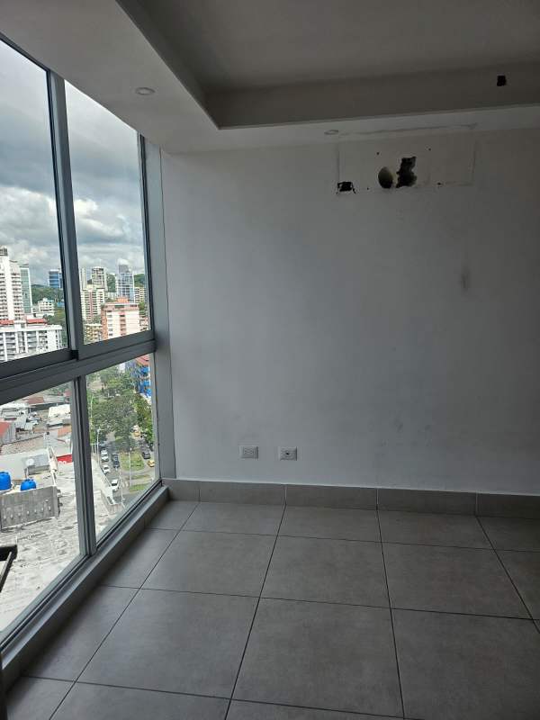 Bright corner bedroom with floor-to-ceiling windows and views in Obarrio PH Park City