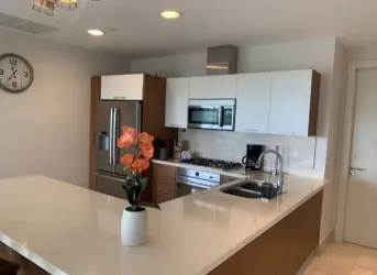 Bright open living dining area with garden view balcony in Buenaventura Golf Beach Resort