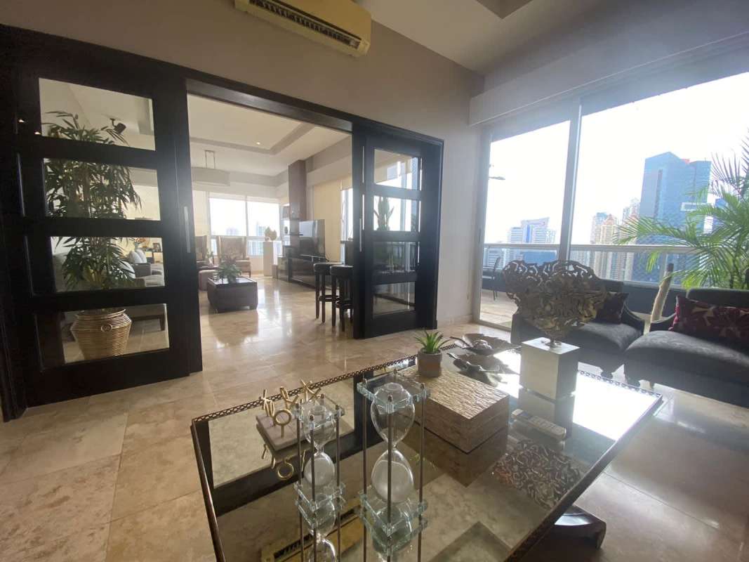 Luxury penthouse bedroom with marble floors balcony and skyline views PH Vista Panama