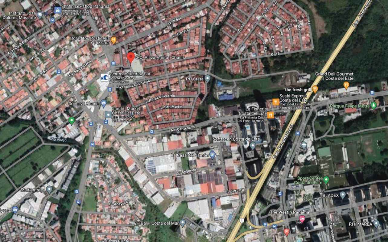 Interior of vacant commercial space with white walls double height ceiling and glass shopfront