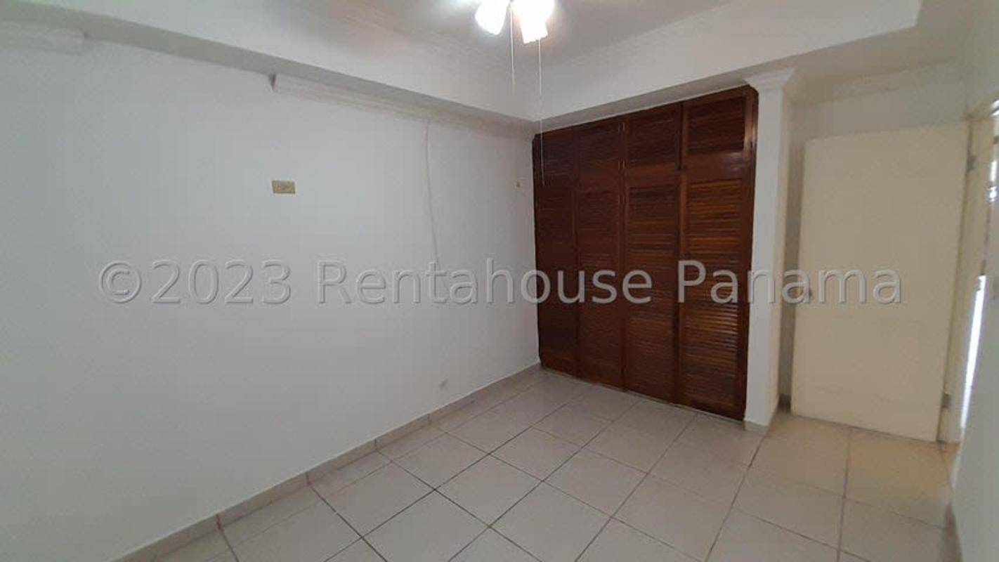 Large living room with tiled floors and windows in house for sale El Bosque Panama