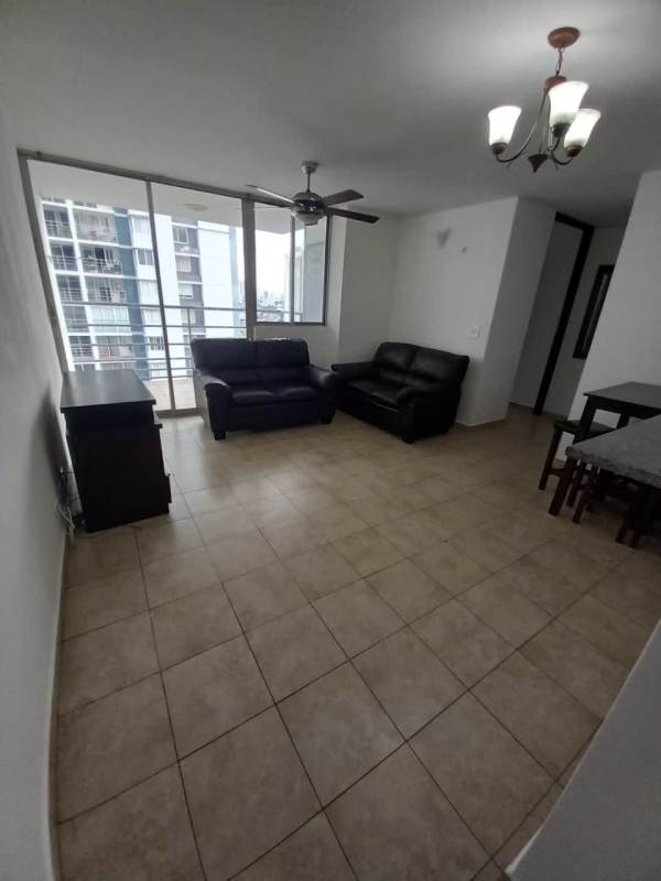 Living room with sliding doors to balcony, tile floor, city view in PH Cosmopolitan Towers Panama