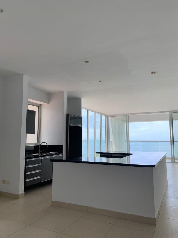 Contemporary kitchen with granite counters and island at PH Rivage Tower Panama City