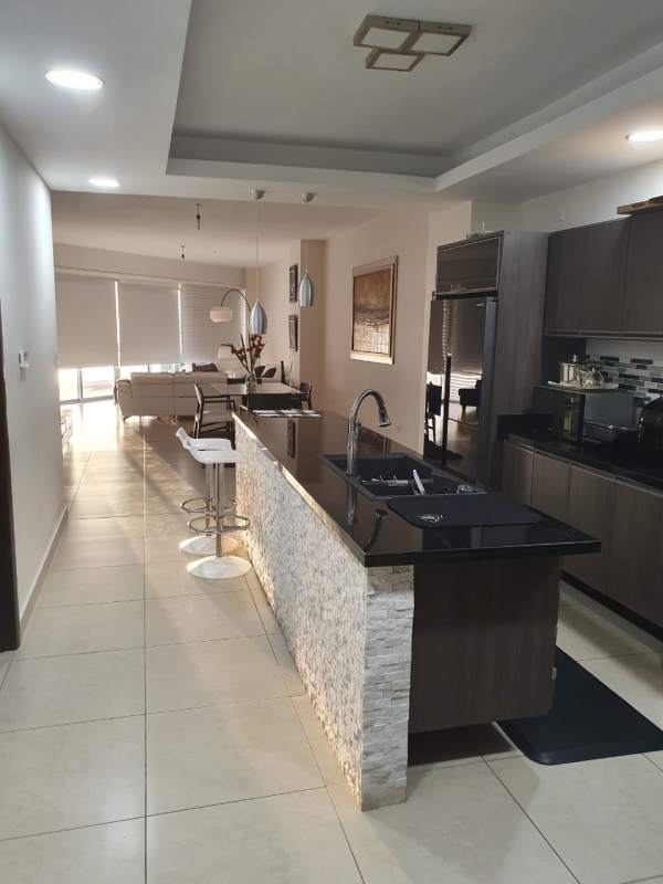 Modern kitchen with granite countertops and appliances in PH Rivage, Avenida Balboa, Panama