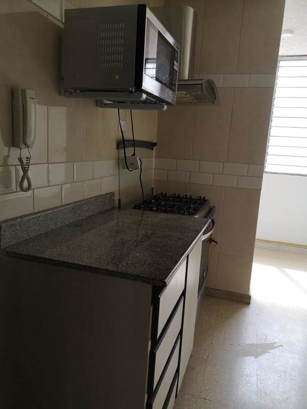 Modern bathroom with granite vanity and glass-enclosed shower PH Aida San Francisco Panama