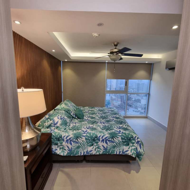 Spacious master bedroom with window city skyline views Park City Obarrio