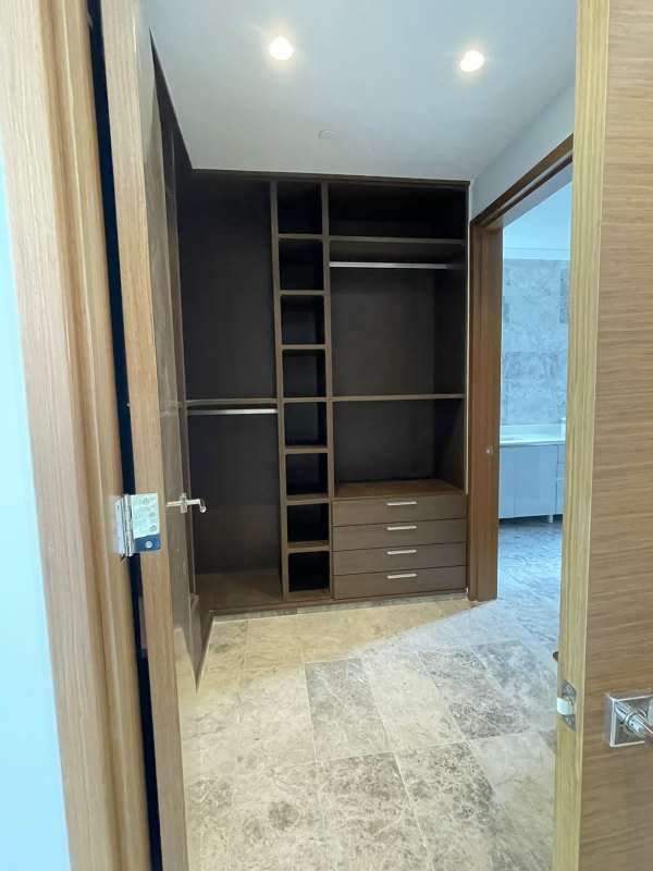 Bright living space with marble floor, large windows and recessed lighting in Empire Residences Panama