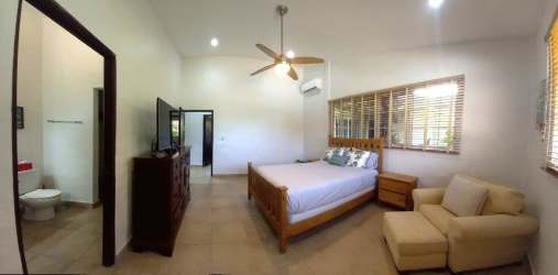 Bright bedroom with AC, fan, large windows, tropical garden views Costa Esmeralda Panama