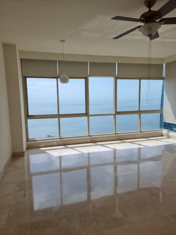 Large master bedroom with ocean view windows, walk-in closet in PH Pacific Point Panama City