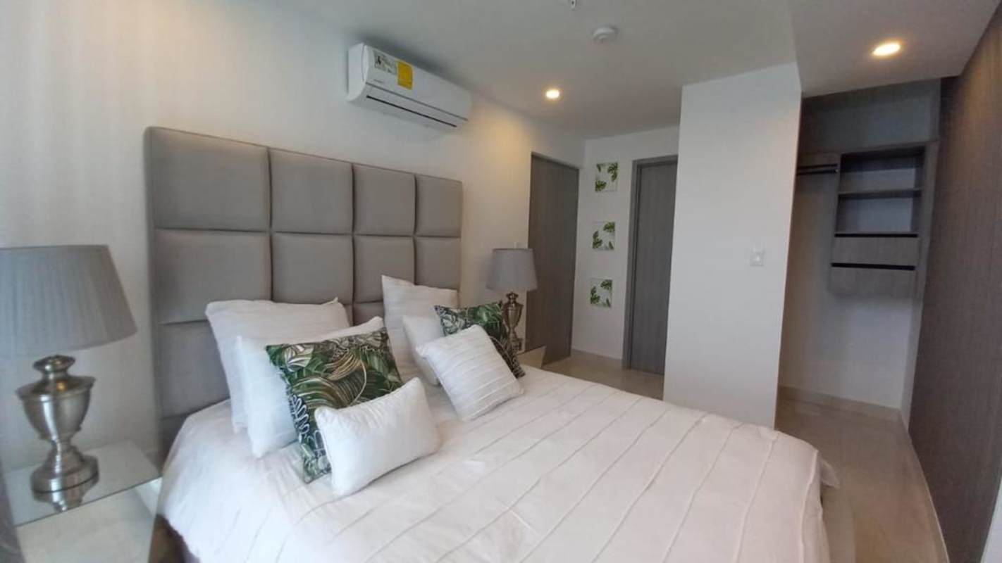 Bright furnished living room with large windows ocean view at The Sands Avenida Balboa Panama City