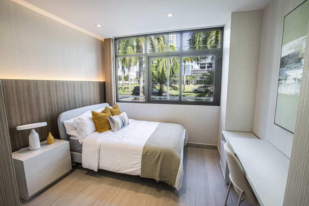 Bedroom with built-in closets and city view in PH Nogal Costa del Este Panama