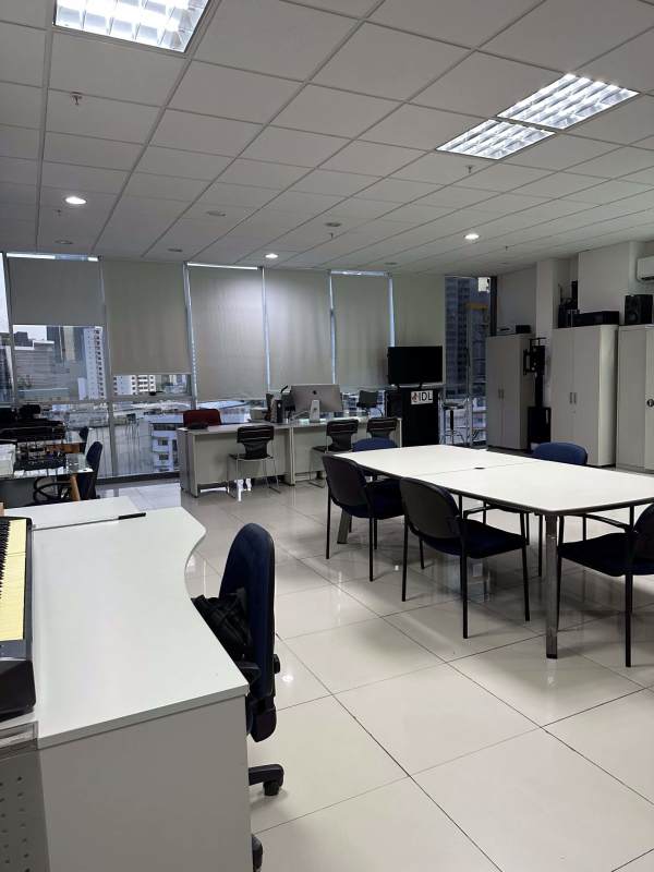 Office space with workstations, AC units, glass dividers and large windows in PH Brazil 405 Panama City