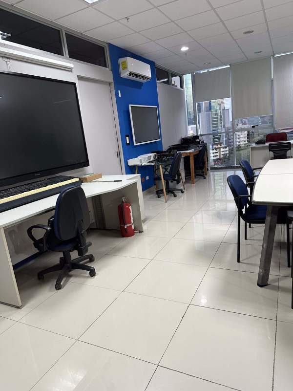 Reception lobby area of commercial office in PH Brazil 405 with sofa and tile floor Panama City
