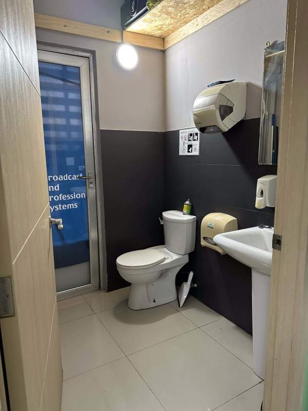 Multiple office desks and large windows with urban views in PH Brazil 405 Panama City