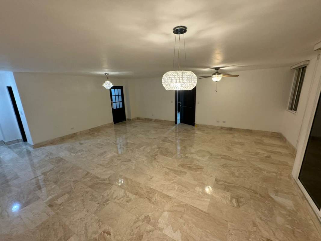 Bright dining area open to living with marble floors in PH Obarrio Center Panama City