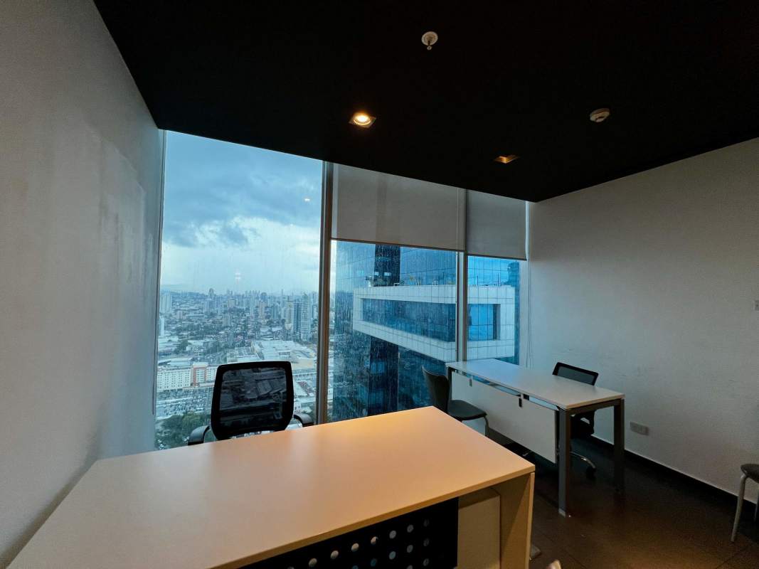 Modern office with large windows and city skyline scenery PH Oceania Panama City
