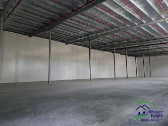 Industrial warehouse interior high ceilings exposed beams concrete floor in David Chiriquí Panama