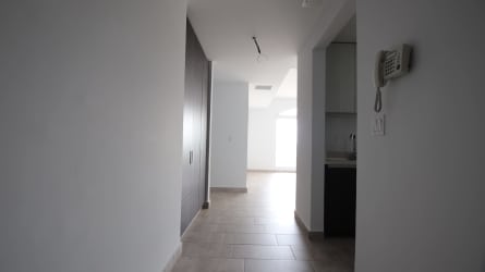 Main bedroom with large window overlooking canal, built-in closet at Tucan Country Club Panama