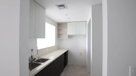 Minimalist modern kitchen with natural light, granite countertops and upper cabinets at Tucan Country Club Panama