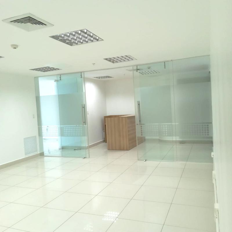 Glass-enclosed meeting rooms in modern furnished office Punta Pacifica Panama
