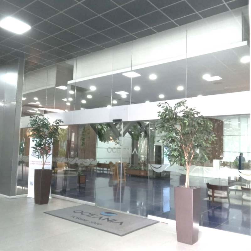 Reception area with wooden desk and glass office partitions Punta Pacifica Panama