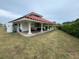 Mediterranean single-family home with large green lawn and arches at Vista Mar San Carlos
