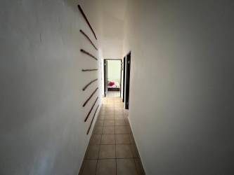 Bright living room with skylight high ceiling and colorful seating at Vista Mar Resort Beach Home