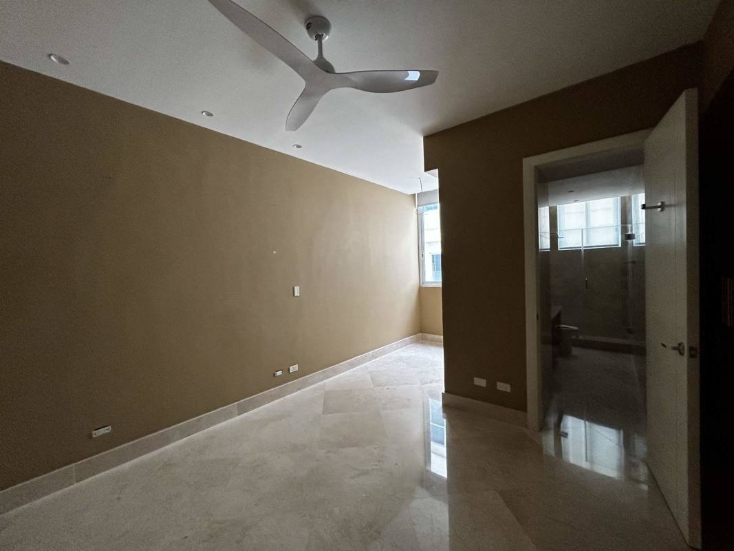 Modern kitchen with granite countertops and stainless steel appliances overlooking the bay in PH The Point Panama City