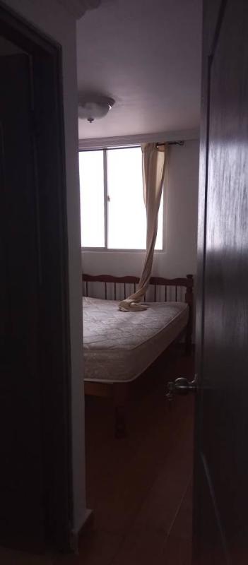 Compact kitchen with microwave, refrigerator, cabinets, tiled walls PH Vista Hermosa Panama City