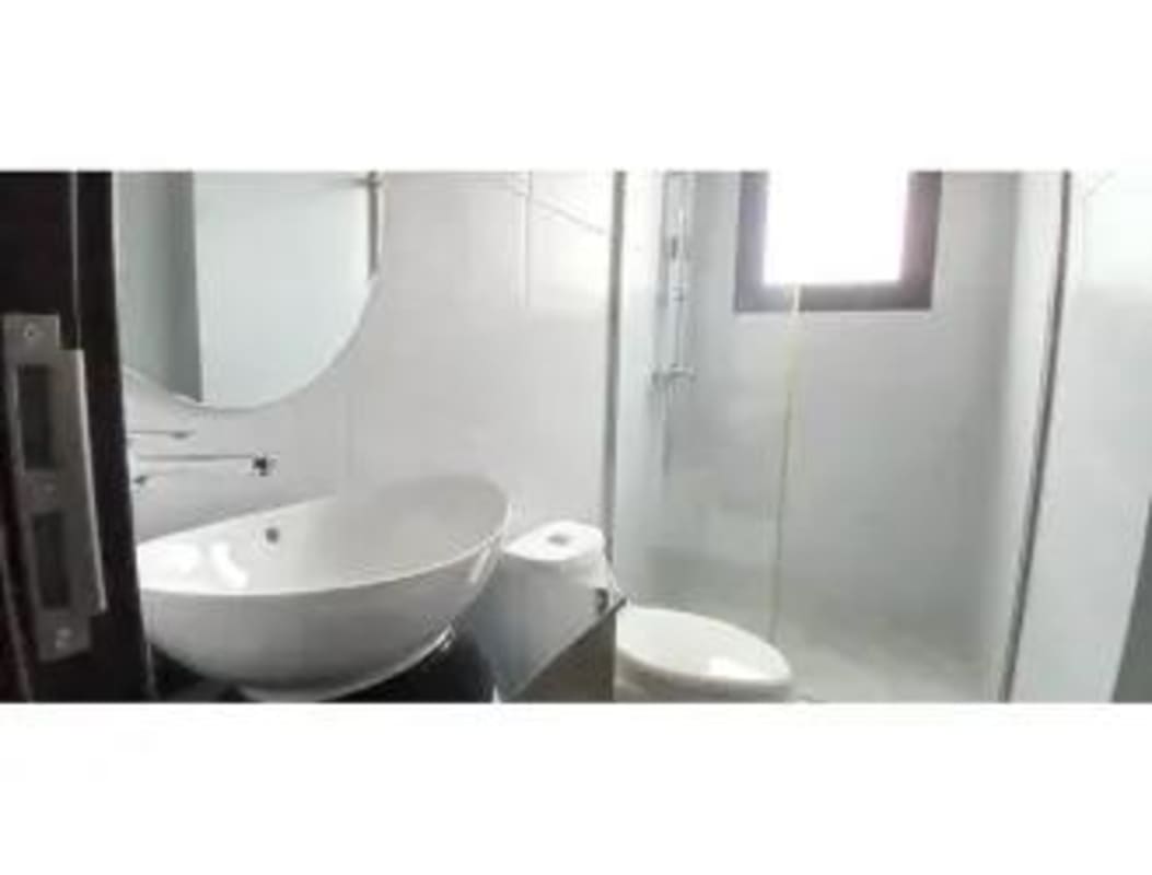 Modern bathroom with vessel sink glass shower enclosure PH Carreras Tower Panama