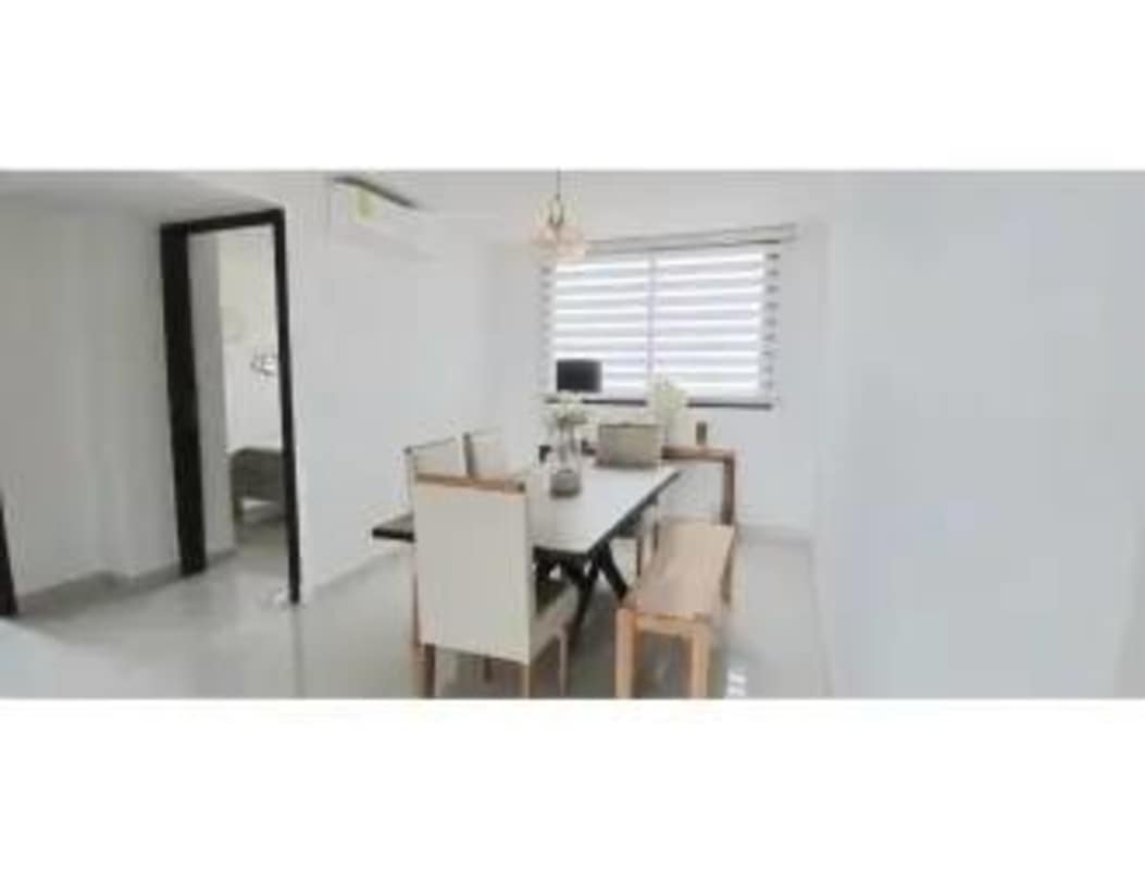 Dining space with large window and modern design in PH Carreras Tower Panama