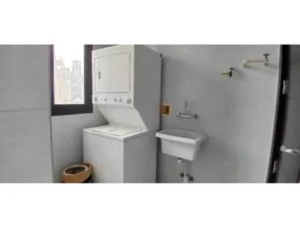 Dedicated laundry room stacked washer dryer utility sink PH Carreras Tower Panama