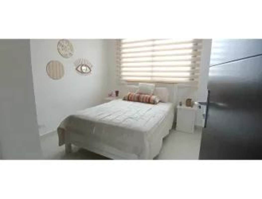 Minimalist bedroom with closet window blinds PH Carreras Tower El Cangrejo Panama