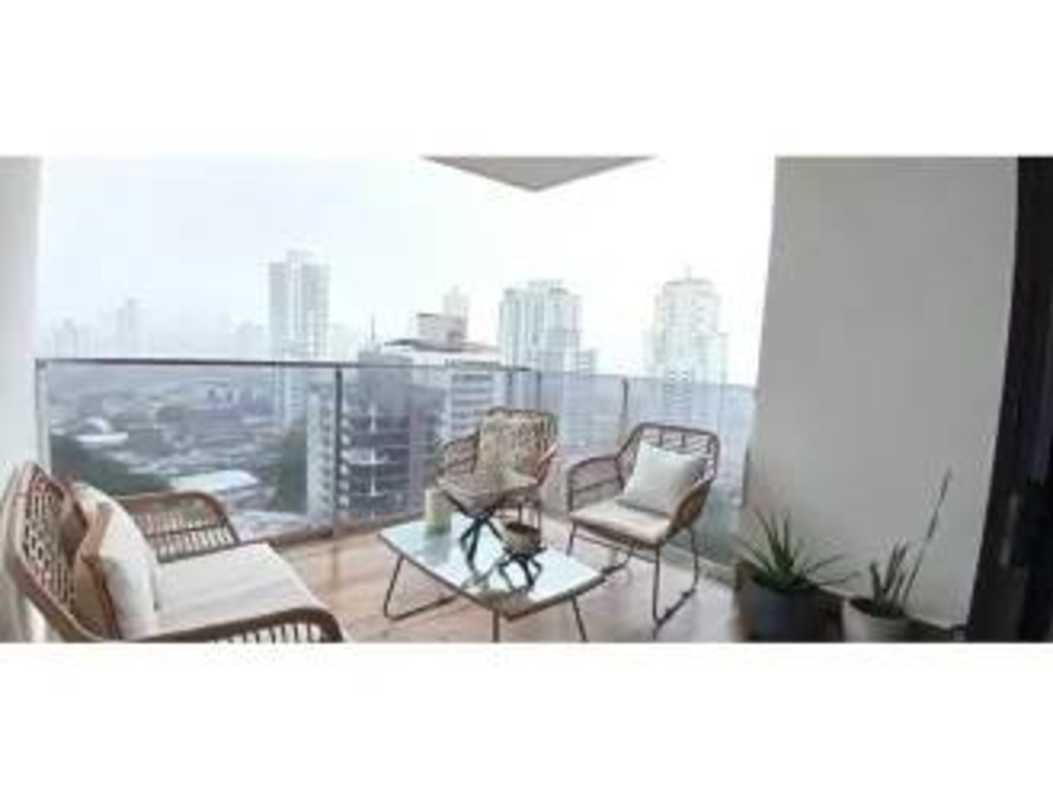Balcony with rattan seating and skyline views at PH Carreras Tower El Cangrejo