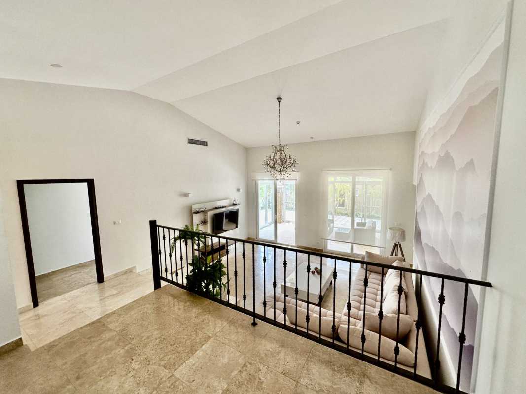 Living room with large windows vaulted ceilings chandelier luxury furnished house in Panama