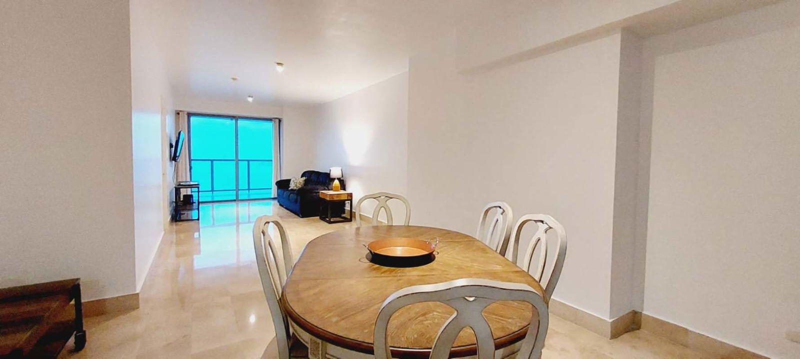 Open plan dining and living with large balcony access ocean view PH Yoo Panama